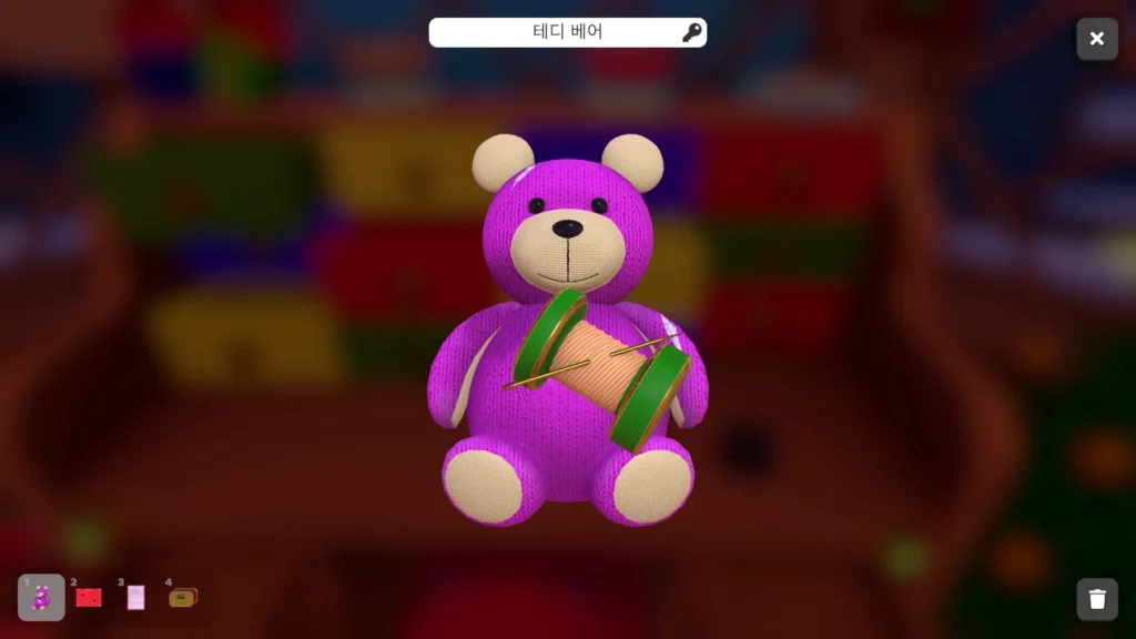 실과 바늘로 찢어진 곰 인형 몸통 꿰매기